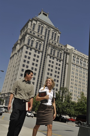 Elon Law students walk in front of the Lincoln Financial building in Greensboro, across the street from Elon Law